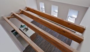 Two-story loft apartment in Center City with wood beam ceilings.